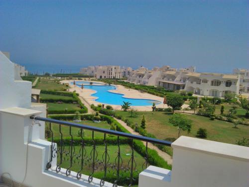 a view from the balcony of a resort at Three-Bedroom Apartment at Louly Beach Resort in Ain Sokhna