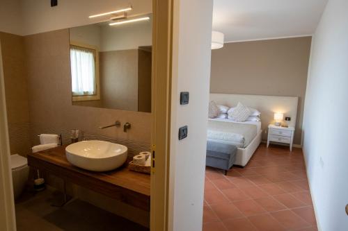 Ένα ή περισσότερα κρεβάτια σε δωμάτιο στο Albergo Canè