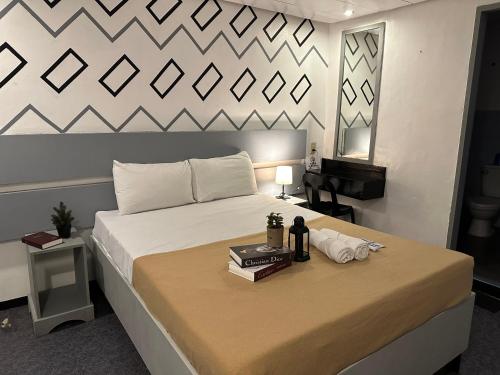 Posteľ alebo postele v izbe v ubytovaní ACME Inn Subic