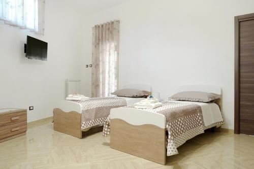 Postel nebo postele na pokoji v ubytování Vesuvius Home