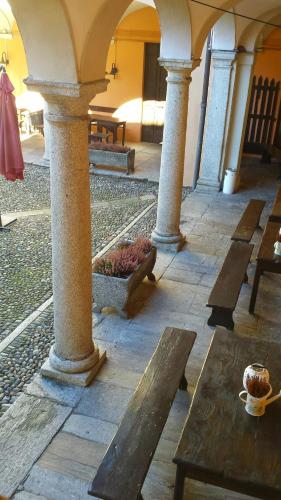 a group of tables and benches in a building at Archi e Colonne in Verbania