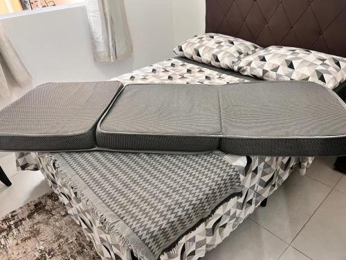 Łóżko lub łóżka w pokoju w obiekcie Apartamento em Florianópolis Próximo ao Aeroporto