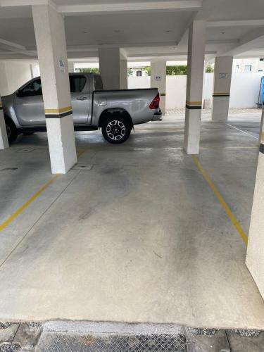 a silver truck parked in a parking lot at A35 - Breeze 03 dormitórios in Bombas