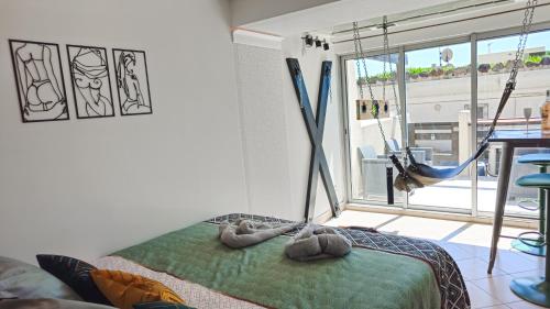 una camera con un letto e una grande finestra di CapSexy Port Nature Garden Naturist Village a Cap d'Agde