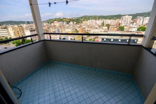 a balcony with a view of a city at Harris&Arvien Apartment's in Vlorë