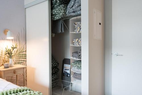 a closet in a bedroom with a mirror at Stylish Downtown Toronto Suite with Free Parking in Toronto