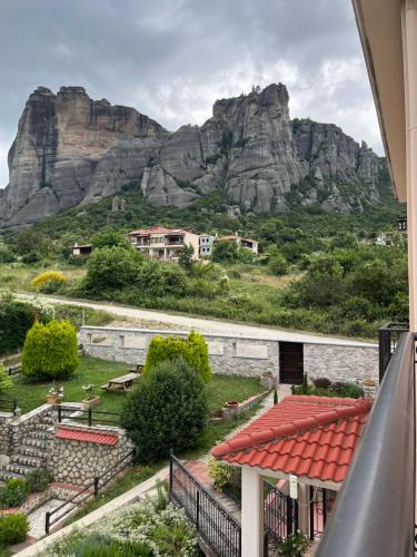 a view of a mountain from the balcony of a house at Epavlis Meteora Suites Hotel in Kalabaka