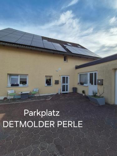 a house with solar panels on the roof at Detmolder Perle in Detmold