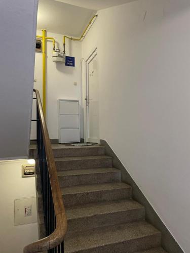 a hallway with stairs in a building with a door at Goga in Pula