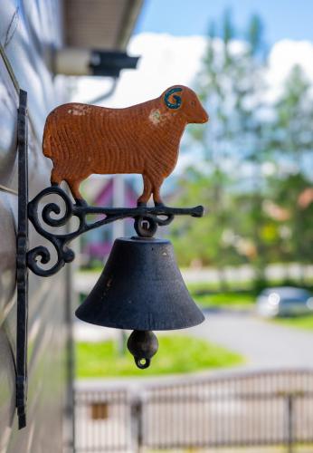 a figurine of a bird on top of a bell at Chata Vanda in Štrba
