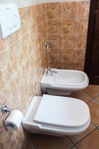 a bathroom with a toilet and a sink at Affittacamere A f r o d i t e in Lipari