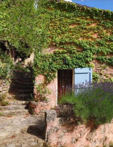 a building with a door on the side of it at La petite maison dans les nuages in Tourtour