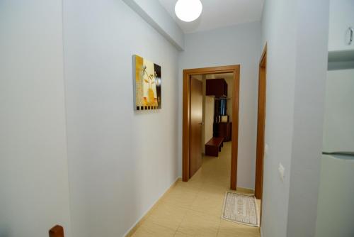 a hallway with a hallway leading to a room at Harris&Arvien Apartment's in Vlorë