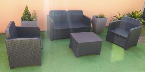 a group of chairs and a table and a table and chairs at Happy Host by YV in Borgomanero