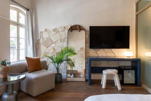 TV a/nebo společenská místnost v ubytování Mila - Boutique Hotel