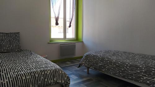 Katil atau katil-katil dalam bilik di Appartement FX 2