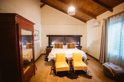 Una cama o camas en una habitación de Hotel Hoja de Parra