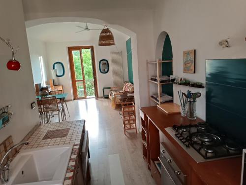 a kitchen with a sink and a stove top oven at La Casa di Nora in Turin
