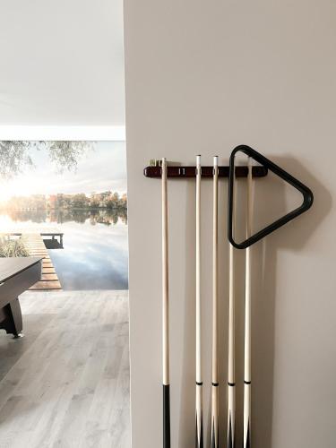 a group of baseball bats hanging on a wall at Grądzka Dolinka in Grądzkie