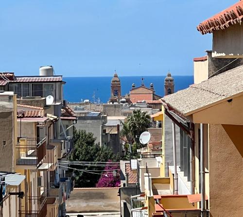 a view of the city from the roofs of buildings at NOVIMO Comfort Apartment - with elevator & secure parking in Terrasini