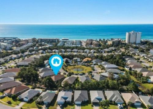 an aerial view of a suburb with a blue arrow sign at Beautiful Pet Friendly Home! Tropical Pool, Optional Golf Cart & Pool Heat, Minutes to Beach in Destin