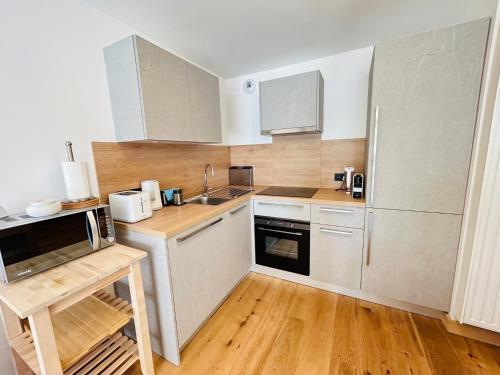 Kuchyň nebo kuchyňský kout v ubytování Cairn Harmony - B103