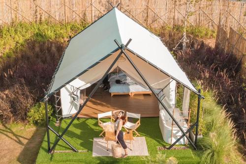 an overhead view of a woman in a tent at SOL Glamping at Khao yai in Ban Nong Makha