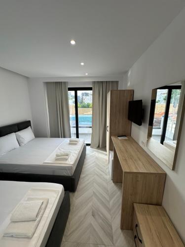 Postel nebo postele na pokoji v ubytování Noa Boutique Hotel