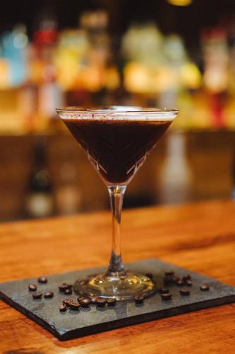 a martini glass sitting on top of a table at Hotel Alaia in Pichilemu