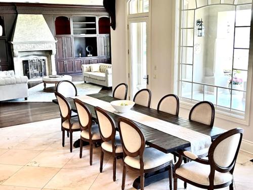 a dining room with a table and chairs at Chateau Montreau on Hudson in Newburgh