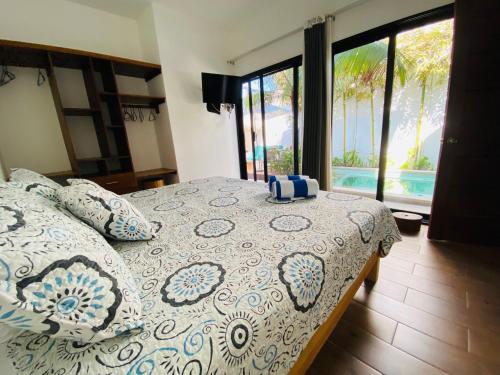 Ένα ή περισσότερα κρεβάτια σε δωμάτιο στο Villa Oasis deLux • Alberca privada