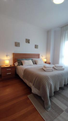 Llit o llits en una habitació de ÁTICO Vilagarcía