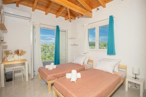 Ένα ή περισσότερα κρεβάτια σε δωμάτιο στο Maison Aleste Lefkada
