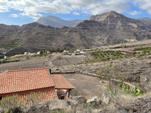 a view of a valley with mountains in the background at Finca Los Dioses III in Mogán