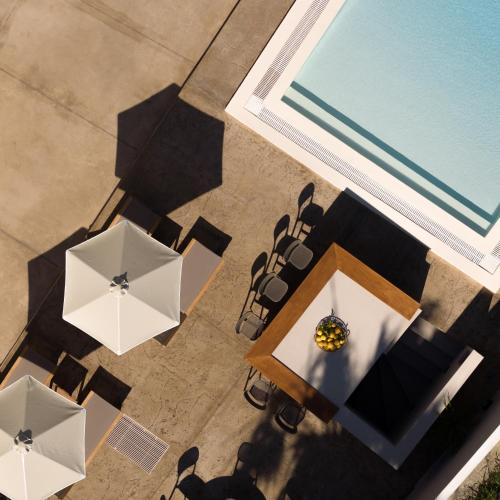an overhead view of a table and chairs with umbrellas at Apollo Plakias in Plakias