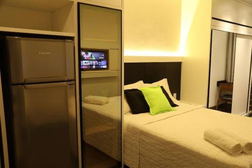 Tempat tidur dalam kamar di Loft moderno no coração de Barreiras