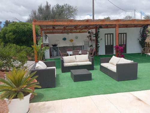 a patio with couches and a gazebo at Design Chalet in Albufeira With Private Pool in Albufeira