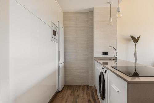 Kuchyň nebo kuchyňský kout v ubytování Nova Aguieira Apartments - Acceso directo playa
