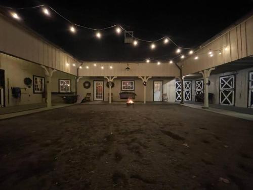 an empty venue with lights and a large room at Historic Middleburg Equestrian Estate in Middleburg