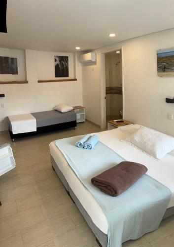 Postel nebo postele na pokoji v ubytování Hotel Casa Cytia