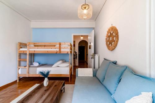 a living room with a couch and a bunk bed at Exarchia Artistic getaway for groups in Athens