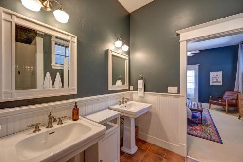 a bathroom with two sinks and a mirror at South Main Residences by Surf Hotel in Buena Vista