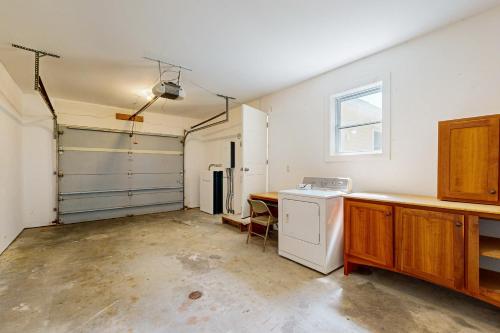 an empty kitchen with a refrigerator and a sink at Electric Mountain in West Townshend