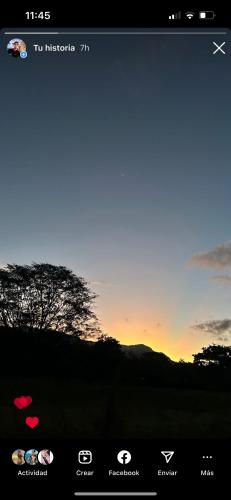 a screenshot of the iphone screen with a sunset at Ballena Oasis Homes & Glamping in Uvita