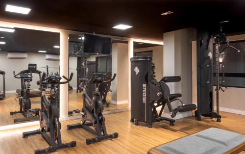 a gym with several treadmills and elliptical machines at Loft com jacuzzi privativa frente mar do Bessa in João Pessoa