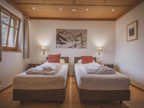 two twin beds in a room with at Bella Vista XL in Vorderwaldberg