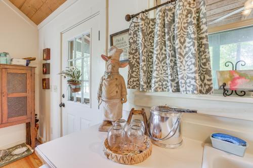 a kitchen with a counter top with jars on it at Charming Lawley Cottage: Deck, Fire Pit & Yard! in Lawley