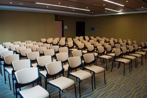 a room with a bunch of chairs in it at Holiday Inn Express - Cartagena Bocagrande by IHG in Cartagena de Indias