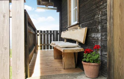 a bench on the porch of a house at Ferienhaus In Eibiswald in Eibiswald