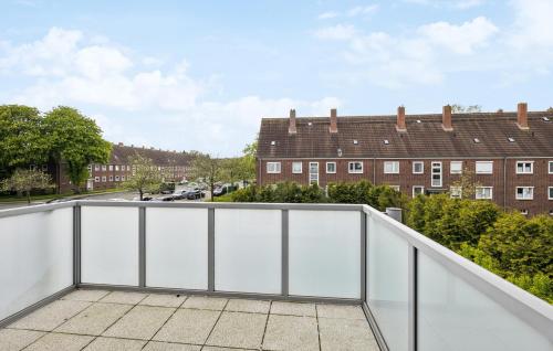 a view from the balcony of a apartment with white fencing at Küstenkind in Wilhelmshaven